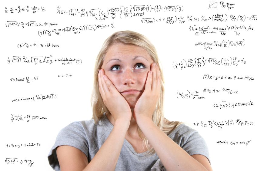 a woman looking at the numbers wondering how to solve the equations