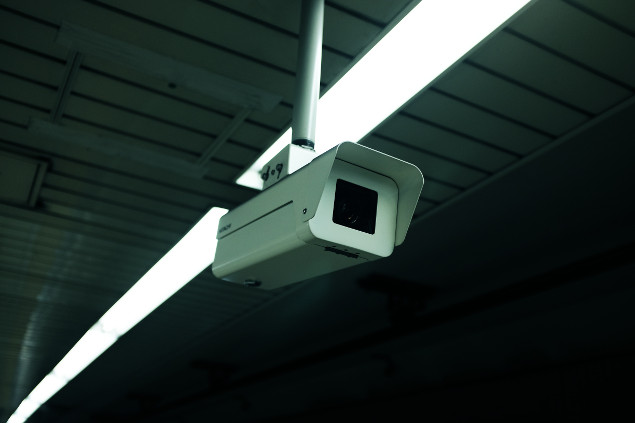 A surveillance camera in the ceiling.